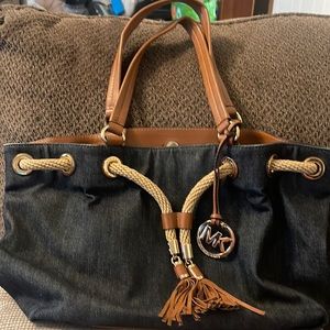 Michael Kors denim bucket bag.